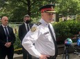 Toronto Police Chief James Ramer, joined by Toronto Police Association President Jon Reid, left, and Mayor John Tory outside Toronto CIty Hall on Friday, July 2 2021