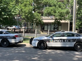 Winnipeg Police cruisers are parked outside of an apartment building in the 300 block of Assiniboine Avenue in downtown Winnipeg on Sunday, July 4, 2021. Police is investigating the city's 19th homicide of the year after officers were called to the apartment block at around 3:30 a.m. on Sunday morning. Police said a male victim was taken to hospital in critical condition, where he died from his injuries. The victim has been identified as 17-year-old Jaden Charles John Oman.