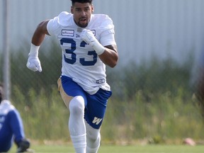 Andrew Harris runs during training camp for the CFL football team in Winnipeg on Saturday, July 10, 2021.