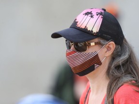 An attendee at the No Truth, No Reconciliation rally at the Manitoba Legislative Building, in Winnipeg.  The rally was against residential school denial, and Bill 64.  Saturday, July 17, 2021.