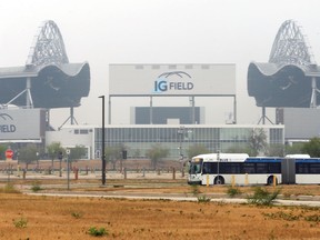 A bus passes IG Field in Winnipeg on Tuesday, July 20, 2021. The Winnipeg Blue Bombers cancelled its training camp session due to poor air quality from forest fires.