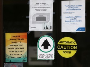 Signs on the front door at City Hall in Winnipeg.  Thursday, July 22/2021.Winnipeg Sun/Chris Procaylo/stf
