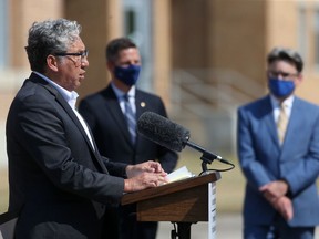 Federal Northern Affairs Minister Dan Vandal speaks while Winnipeg Mayor Brian Bowman,and City Councillor for St.Vital Brian Mayes (left) look on, at the North End Water Pollution Control Centre, in Winnipeg on Friday, July 23, 2021.
