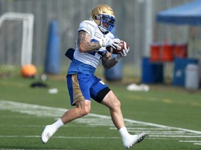 Fullback Mike Miller makes a catch during Winnipeg Blue Bombers practice on the University of Manitoba campus in Winnipeg on Thurs., July 22, 2021.