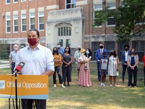 NDP Leader Wab Kinew is surrounded by politicians, educators and parents for a press conference at Riverview School in Winnipeg on Tuesday, July 27, 2021, where the NDP laid out the actions it feels the province must take to a successful return to school in the fall.