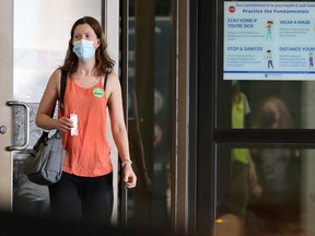 A woman exits the COVID-19 vaccination site at RBC Convention Centre in Winnipeg on Tuesday, July 27, 2021.