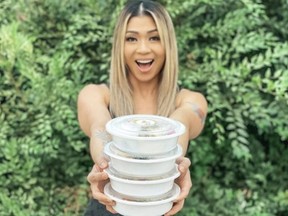 Vicky Nguyen of a Healthy Hand poses with four different bowls of low calorie meals her complany has on offer.
Hein Nguyen photo