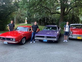 High school car buddies (left to right) Mateo Cecchinia, Marc Testa and Matthew Marsolais help each other restore their collector cars, respectively, a 1968 Chevrolet Camaro, a 1969 Dodge Charger, and a 1958 Pontiac Laurentian.