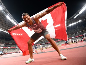 Andre De Grasse of Team Canada celebrates after winning the bronze medal in the Men's 100m Final on day nine of the Tokyo 2020 Olympic Games at Olympic Stadium.