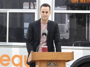 Adam Budowski, a planner with Winnipeg Transit, speaks with media on Wednesday at Winnipeg Transit’s Osborne garage regarding Transit’s new On-Request pilot project. James Snell/Postmedia
