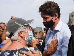 Prime Minister Justin Trudeau greets a supporter during his election campaign tour in Mississauga, Ont., Friday, Aug. 27, 2021.