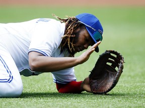 Vladimir Guerrero Jr. of the Blue Jays reacts after slipping on the infield in the second inning against the Detroit Tigers at Rogers Centre on Sunday, Aug. 22, 2021 in Toronto.