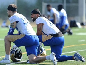 Winnipeg Blue Bombers slotback Nic Demski (right) chats with wide receiver Drew Wolitarsky during a practice. The Bombers take on the 1-2 Calgary Stampeders in Winnipeg on Sunday.  KEVIN KING/Winnipeg Sun