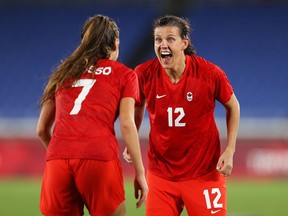 Christine Sinclair (12) of Team Canada celebrates with Julia Grosso (7) following their team's victory in the penalty shoot out in the Women's Gold Medal Match between Canada and Sweden at the Tokyo 2020 Olympic Games at International Stadium Yokohama on August 6, 2021 in Yokohama, Japan.