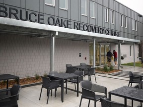 A woman walks past the site of the Bruce Oake Recovery Centre in Winnipeg on Monday, June 1, 2020. The facility opened earlier this spring.