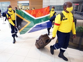 Part of a contingent of 100 South African firefighters here to assist with Manitoba forest fires arrive at Winnipeg International Airport on Wed., Aug. 11, 2021. KEVIN KING/Winnipeg Sun/Postmedia Network