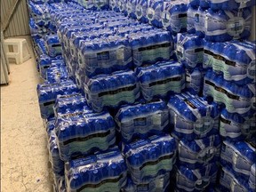 Delivered bottled water sits in a warehouse in Tataskweyak Cree Nation. Residents in the community have relied on bottled water for drinking since a boil-water advisory was first put in place in 2017. Handout