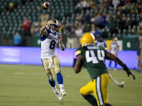 Winnipeg Blue Bombers' quarterback  Zach Collaros (8) makes a pass against the Edmonton Elks during first half CFL action at Commonwealth Stadium, in Edmonton Saturday Sept. 18, 2021.