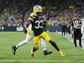 Packers' Aaron Jones scores a touchdown against the Lions during second half NFL action at Lambeau Field in Green Bay, Wis., Monday, Sept. 20, 2021.