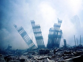 In this file photo taken on September 11, 2001, the rubble of the twin towers of the World Trade Center smoulder following a terrorist attack in lower Manhattan, New York. - The remains of two more victims of 9/11 have been identified, thanks to advanced DNA technology, New York officials announced on September 8, 2021, just days before the 20th anniversary of the attacks. The office of the city's chief medical examiner said it had formally identified the 1,646th and 1,647th victim of the al-Qaeda attacks on New York's Twin Towers which killed 2,753 people. They are the first identifications of victims from the collapse of the World Trade Center since October 2019. (Photo by Alexandre FUCHS / AFP) (Photo by ALEXANDRE FUCHS/AFP via Getty Images)