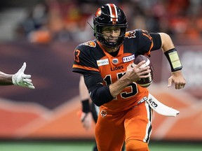B.C. Lions quarterback Michael Reilly rushes for a first down during the first half of a CFL football game against the Ottawa Redblacks in Vancouver on Saturday.
