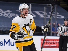 Pittsburgh Penguins centre Sidney Crosby celebrates a goal against the New York Islanders at Nassau Veterans Memorial Coliseum.