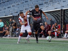 Cavs midfielder David Normal Jr. moves the ball upfield during Saturday's 1-1 draw with Valour FC in Winnipeg.