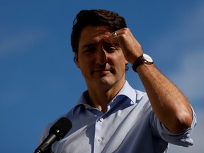 Prime Minister Justin Trudeau speaks to media after visiting a vaccination clinic in Ottawa, Sept. 28, 2021.