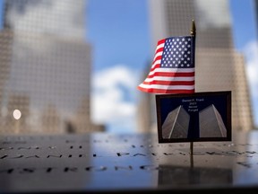 A postcard of the Twin Towers is seen at the 9/11 Memorial ahead of the 20th anniversary of the September 11 attacks in Manhattan, New York City, U.S., September 10, 2021. REUTERS/Carlos Barria