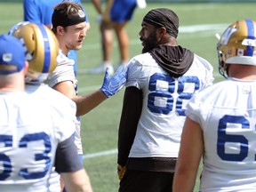 Wide receiver Rasheed Bailey (right) is calmed by Drew Wolitarsky during Winnipeg Blue Bombers practice at IG Field on Wed., Sept. 1, 2021.
