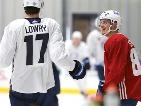 Nate Schmidt (right) speaks with Adam Lowry during Winnipeg Jets training camp at Bell MTS Iceplex in Winnipeg on Mon., Sept. 27, 2021. KEVIN KING/Winnipeg Sun/Postmedia Network