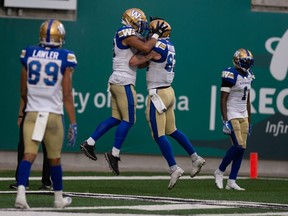 The Winnipeg Blue Bombers celebrate after scoring a touchdown during the Labour Day Classic against the Saskatchewan Roughriders at Mosaic Stadium in Regina, Saskatchewan on Sept. 5, 2021. 
 BRANDON HARDER/ Regina Leader-Post ORG XMIT: POS2109052038066136