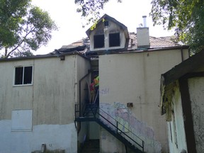 Two workers work to board up a vacant three-storey house in the 100 block of Mayfair Avenue in Winnipeg on Friday. At shortly after 10:40 p.m. on Thursday, the Winnipeg Fire Paramedic Service responded to reports of a fire in the house. No damage estimates are available at this time but the structure is considered to be a complete loss. It had previously been damaged by fire in 2018. It is the latest blaze in a troubling growing trend of fires in vacant buildings in Winnipeg.