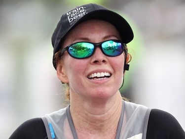 Manitoba Marathon runner Cheryl Stewart is just about ready for that beer after crossing the finish line on Chancellor Matheson Road in Winnipeg on Sunday, Sept. 5, 2021.