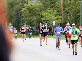 Runners on South Drive during the Manitoba Marathon in Winnipeg on Sunday, Sept. 5, 2021.