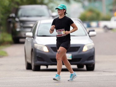 Vanessa Ruys runs on Point Road during the half marathon at the Manitoba Marathon in Winnipeg on Sunday, Sept. 5, 2021.