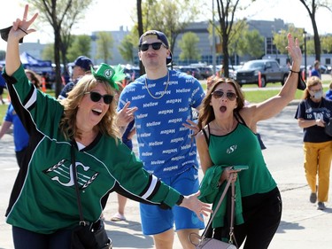 Winnipeg Blue Bombers and Saskatchewan Roughriders fans interact ahead of the Banjo Bowl battle in Winnipeg on Saturday, Sept. 11, 2021.