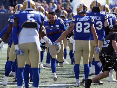 Winnipeg Blue Bombers RB Andrew Harris runs onto the field for the Banjo Bowl against the Saskatchewan Roughriders in Winnipeg on Saturday, Sept. 11, 2021.