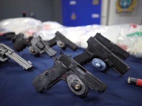 A selection of seized drugs and weapons on display during a press conference at Winnipeg Police headquarters on Smith Street on Wed., Sept. 15, 2021.  KEVIN KING/Winnipeg Sun/Postmedia Network