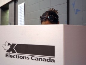 A person casts their vote in the federal election at a polling station at Centre Culturel Franco-Manitobain on Provencher Boulevard in Winnipeg on Mon., Sept. 20, 2021. KEVIN KING/Winnipeg Sun/Postmedia Network