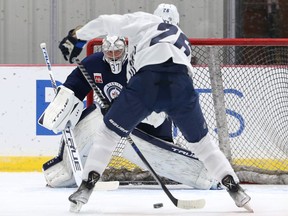 Connor Hellebuyck stares down Blake Wheeler on a breakaway during the first day of Winnipeg Jets training camp in Winnipeg on Thurs., Sept. 23, 2021. KEVIN KING/Winnipeg Sun/Postmedia Network