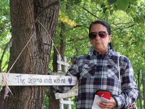 Arlene Last-Kolb looks at some of the memorials in the Gone to Soon Garden in Stephen Juba Park in Winnipeg on Sept. 17, 2021. Last-Kolb is advocating for narcan to replace naloxone and for safe supply in Manitoba.