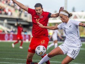 New Zealand’s Daisy Cleverley receives a penalty while battling against Canada’s Christine Sinclair in Ottawa yesterday.