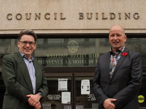 Winnipeg City Councillors Shawn Nason (Transona) right, and Brian Mayes (St. Vital) left, pose for a photo after successfully passing a motion to bring a portion of Transit Plus back under the City's purview.