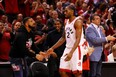 Kawhi Leonard of the Toronto Raptors high fives rapper Drake during game four of the NBA Eastern Conference Finals between the Milwaukee Bucks and the Toronto Raptors on May 21, 2019.