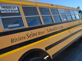 A Seine River School Division (SRSD) school bus sits at a bus depot just south of Winnipeg. SRSD is now warning parents that school bus driver shortages have become so problematic that basic bus services for students could be disrupted. Photo by Dave Baxter/Winnipeg Sun