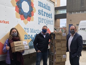 (Left to right) Ana Ziprick, Director of Development, Main Street Project; Shaun Jeffrey, Executive Director, Manitoba Restaurant & Foodservices Association; and Dale Maksymyk, President, Gordon Food Service. Manitoba Restaurant & Foodservices Association and Gordon Food Service donated 22 cases of coffee to Main Street Project. The coffee, with a wholesale value of $1,000, was dropped off this week at the Main Street Project offices at 75 Martha Street in Winnipeg.