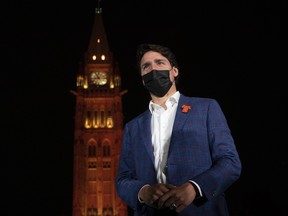 The Peace Tower glows orange as Prime Minister Justin Trudeau participates in a ceremony on Parliament Hill on the eve of the first National Day of Truth and Reconciliation, Wednesday, September 29, 2021 in Ottawa.