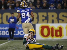 Winnipeg Blue Bombers' Jackson Jeffcoat (94) sacks Edmonton Elks quarterback Trevor Harris (7) during the second half of CFL action in Winnipeg Friday. The Blue Bombers defence did not allow a touchdown in the game (fourth time this season), did not allow a point in the second half (fourth time), held an opponent under 10 points (sixth time), and gave up absolutely nothing in the fourth quarter (six points against all season).