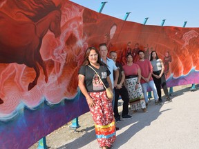 (Left to right) Jeannie White Bird, Charlie Johnston, Brad Lent, Bobbie Sinclair, Jon Ostash, and Ashley Christiansen have all worked for the last two years to create the Sacred Spirits of Turtle Island MMIWG2S+ Mural project, which was unveiled in Selkirk on Monday.